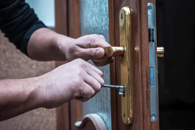 a locksmith opening a door